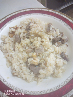 Una foto de Arroz con ternera