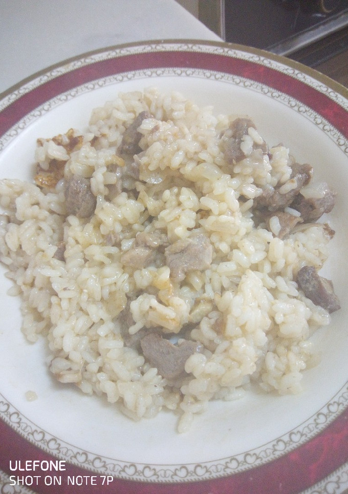 Una foto de Arroz con ternera