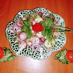 A picture of Red radish, onion, cucumber 🥗 salad.