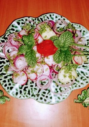 A picture of Red radish, onion, cucumber 🥗 salad.