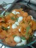 Melone con mozzarelle ciliegine prosciutto crudo e rucola