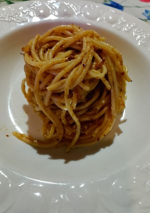 A picture of Spaghetti with Genovese Pesto, Pecorino Romano, Toasted Walnuts, and Chopped Pistachios.