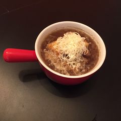 A picture of French Onion Soup with Parmesan/Mozzarella Croutons.