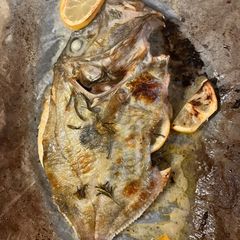 A picture of Baked John Dory fish with lemon, garlic and rosemary.