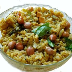 A picture of Poha tamarind uppuma (aval puli uppuma Tamil).