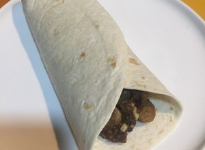 Una foto de Taco de setas y morcilla de arroz