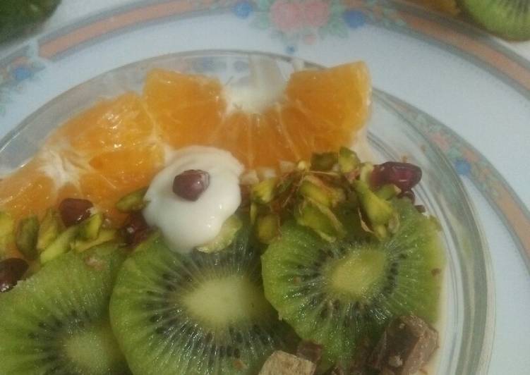 A fancy fruit&amp;yogurt bowl with choco-pistachio