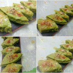 A picture of Presenting green glory dhokla filled with leafy greens!.