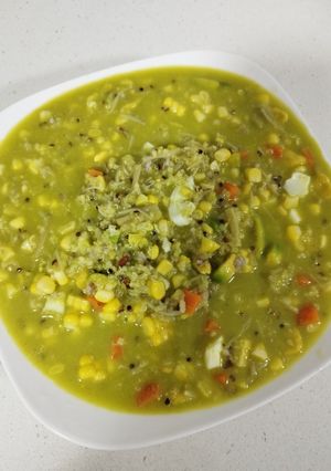 A picture of Corn and Avocado Porridge with Enoki Mushrooms.