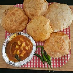 A picture of Bedmi poori with aloo sabji (breakfast).