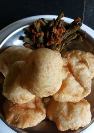 A picture of Lentil kachori with spicy lady fingers.