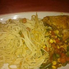 A picture of Grilled Chicken with Spaghetti and veggies.