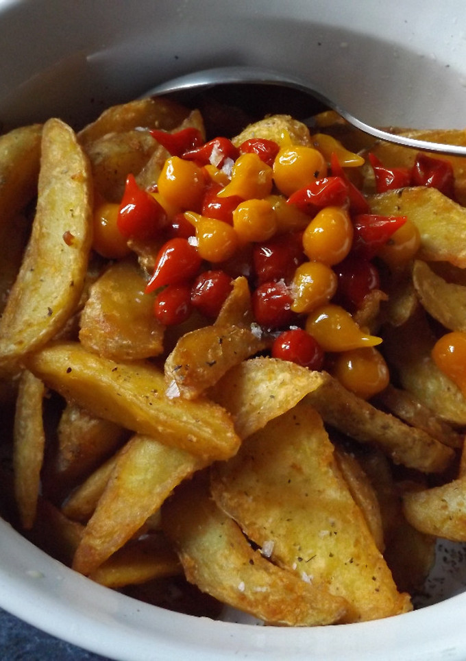 Una foto de Cuñas de patatas al orégano