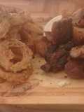 Fried porque and  whole onion rings by luis