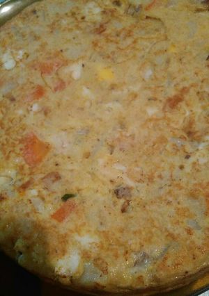 Una foto de Tortilla de papa y pollo