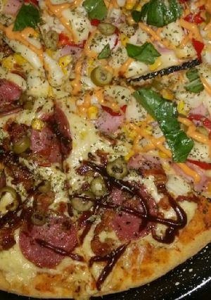 Una foto de Pizzas Caseras. Palmitos/salames y BBQ