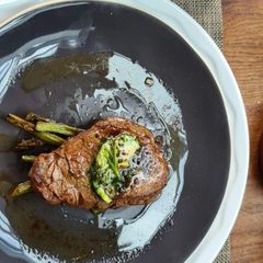 A picture of Fillet with Asparagus, Potato dauphinoise and red wine jus.