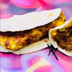 A picture of Schezwan egg tortillas.