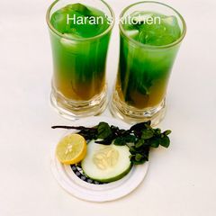 A picture of Mint leaves and cucumber juice.