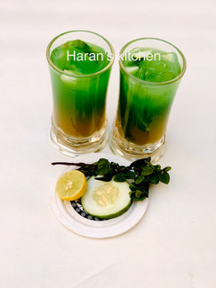 A picture of Mint leaves and cucumber juice.