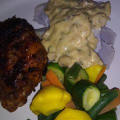 A picture of Amadumbe with coriander mushroom sauce.