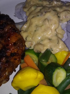 A picture of Amadumbe with coriander mushroom sauce.