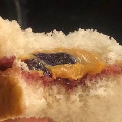 A picture of PB&J but only one slice of bread.