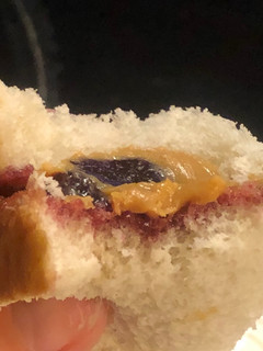 A picture of PB&J but only one slice of bread.
