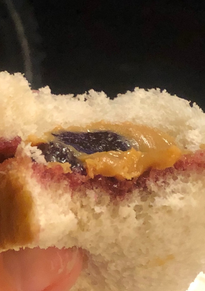 A picture of PB&J but only one slice of bread.