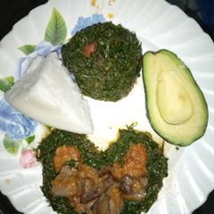 A picture of Ugali,kales and liver stew.