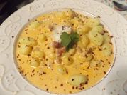Una foto de gnocchi de patata con nata
