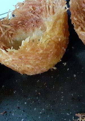 Una foto de Nido de papas fritas relleno con cerdo a la barbacoa