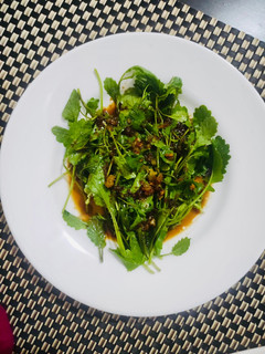 A picture of Mustard leaves in Garlic sauce.