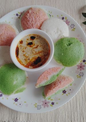 A picture of Tricolour Rice and urad dal idli with natural veggie colour.