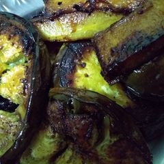 A picture of Brinjal and pumpkin slices fry.