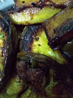 A picture of Brinjal and pumpkin slices fry.