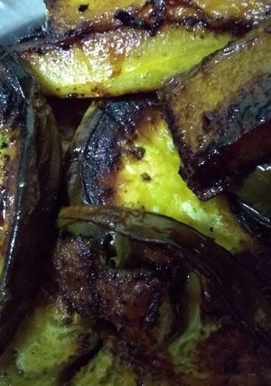 A picture of Brinjal and pumpkin slices fry.