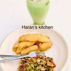 A picture of Coated fried potatoes with veggie egg sauce.