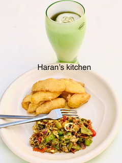 A picture of Coated fried potatoes with veggie egg sauce.