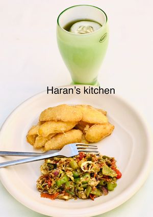 A picture of Coated fried potatoes with veggie egg sauce.