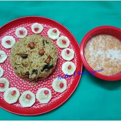 A picture of Peanut rice with bundi raita.