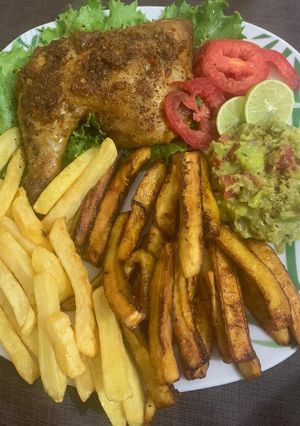 A picture of Juicy roasted chicken with chips & plantain and guacamole.