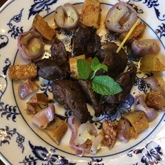 A picture of California Farm Tea Smoked Shallots and Chicken Liver Snack.