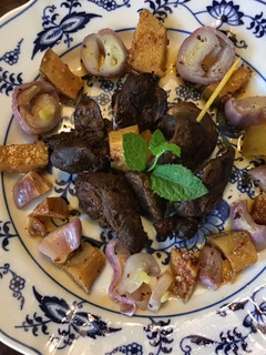 A picture of California Farm Tea Smoked Shallots and Chicken Liver Snack.