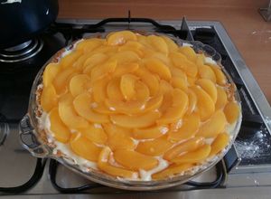 Una foto de Tarta de duraznos y crema pastelera