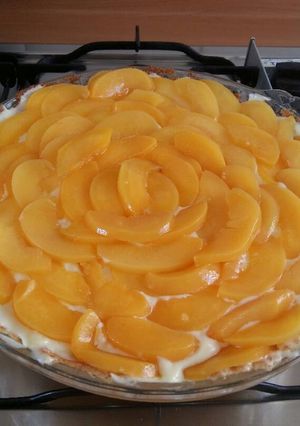 Una foto de Tarta de duraznos y crema pastelera