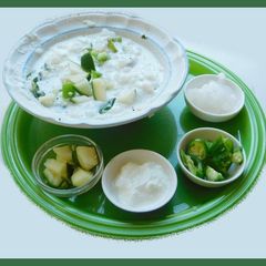 A picture of Curd rice with mangoes.