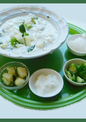 A picture of Curd rice with mangoes.