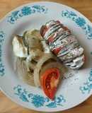 Papa abanico rellena con tomate y zapallo italiano