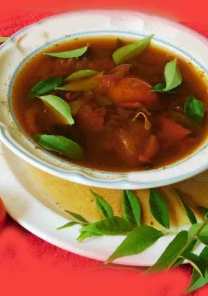 A picture of Black Garlic Rasam (Soup).